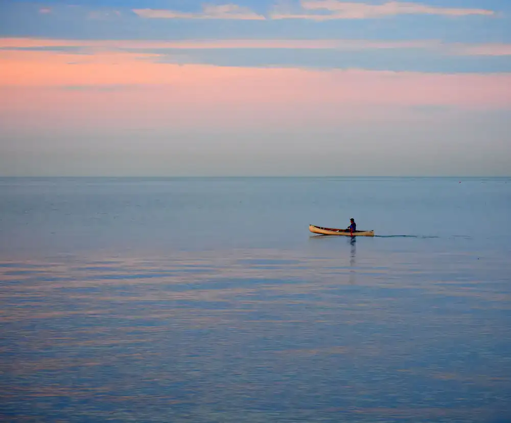 Kayak resting on calm water